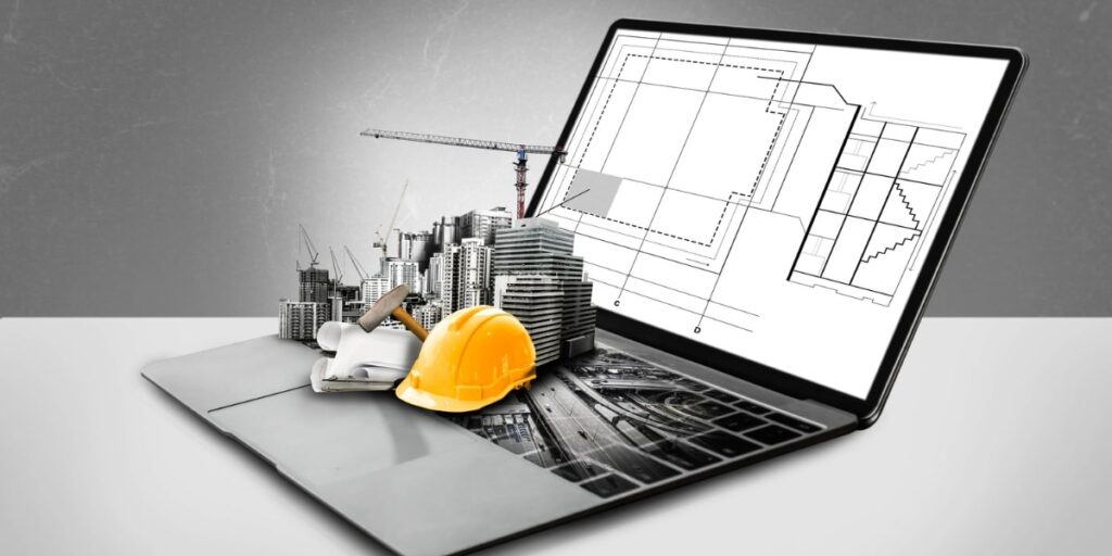 Imagem de um laptop com maquete de construção, capacete e plantas, simbolizando automação industrial na…