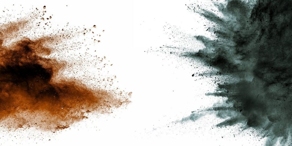 Explosão de poeira combustível em fundo branco, representando riscos em sistemas de automação industrial e…